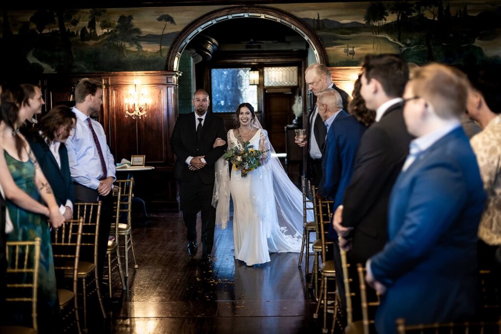 bride being walked down the aisle at semple mansion