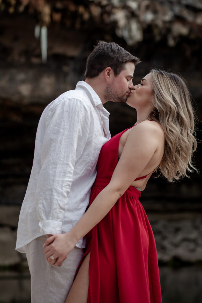 stunning engagement photo session of a young couple at Hamilton Pool Preserve and Hotel Vista