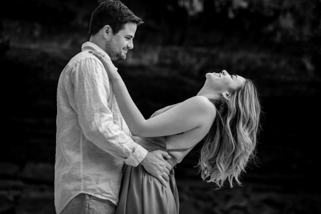 stunning engagement photo session of a young couple at Hamilton Pool Preserve and Hotel Vista