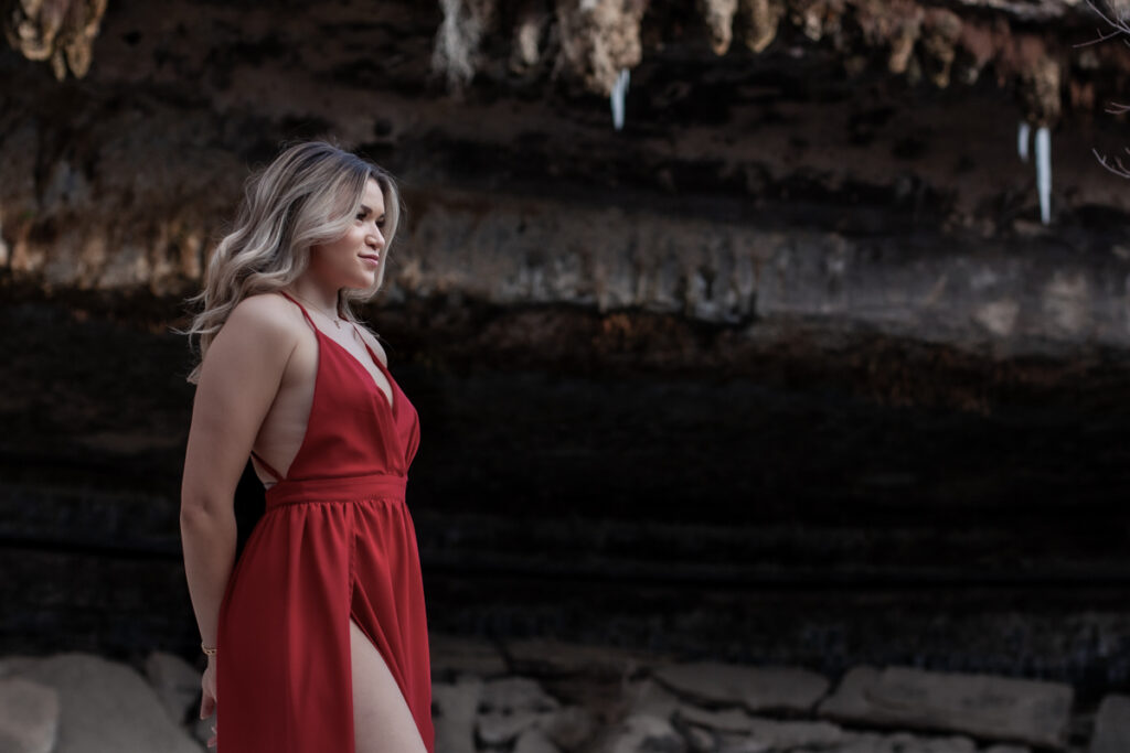 stunning engagement photo session of a young couple at Hamilton Pool Preserve and Hotel Vista