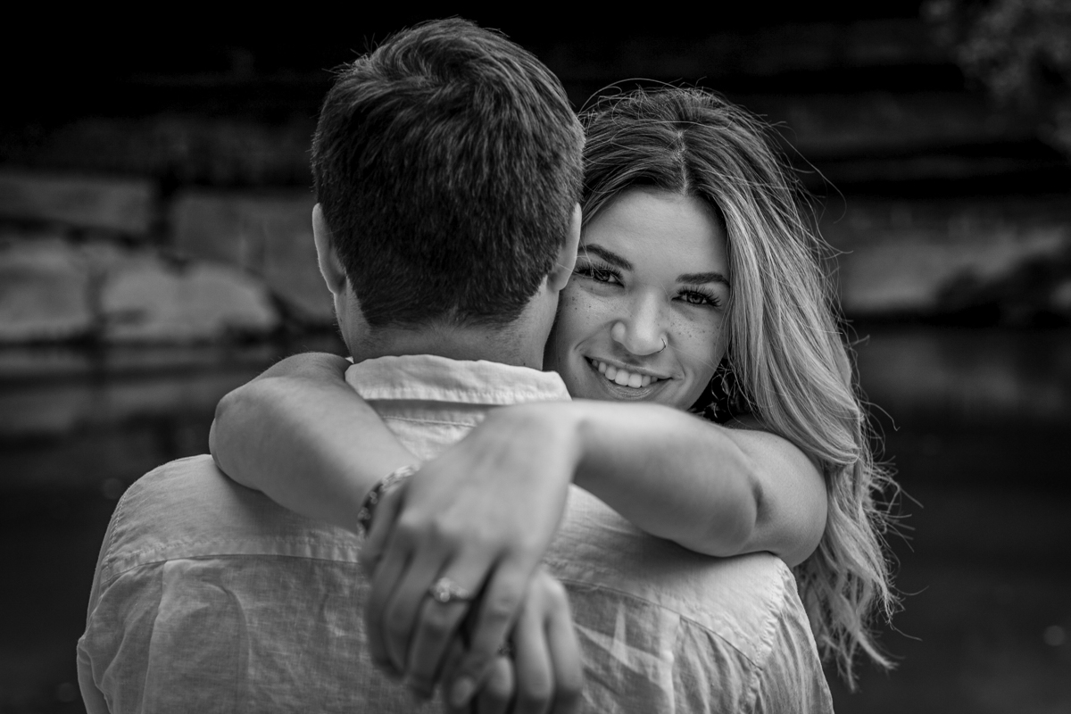 stunning engagement photo session of a young couple at Hamilton Pool Preserve and Hotel Vista