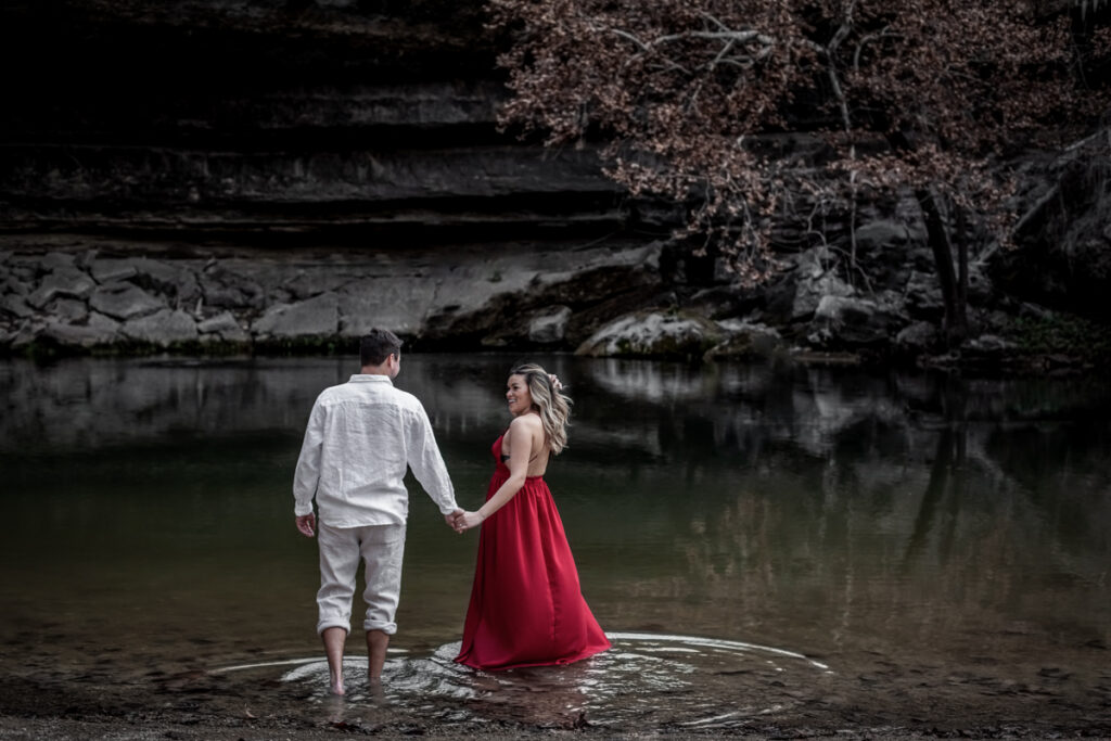 stunning engagement photo session of a young couple at Hamilton Pool Preserve and Hotel Vista