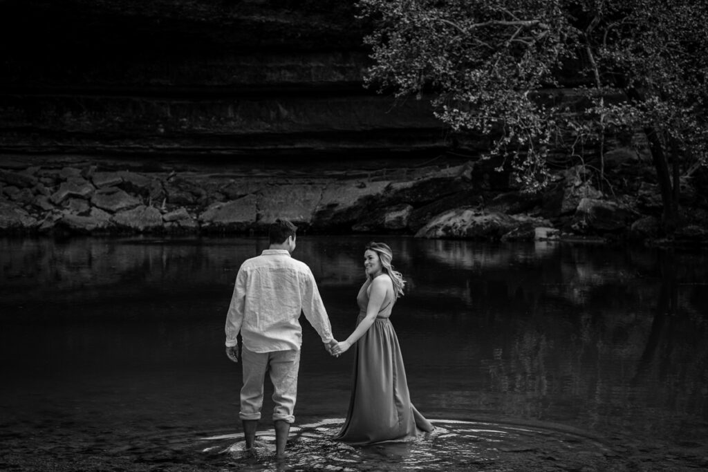 stunning engagement photo session of a young couple at Hamilton Pool Preserve and Hotel Vista