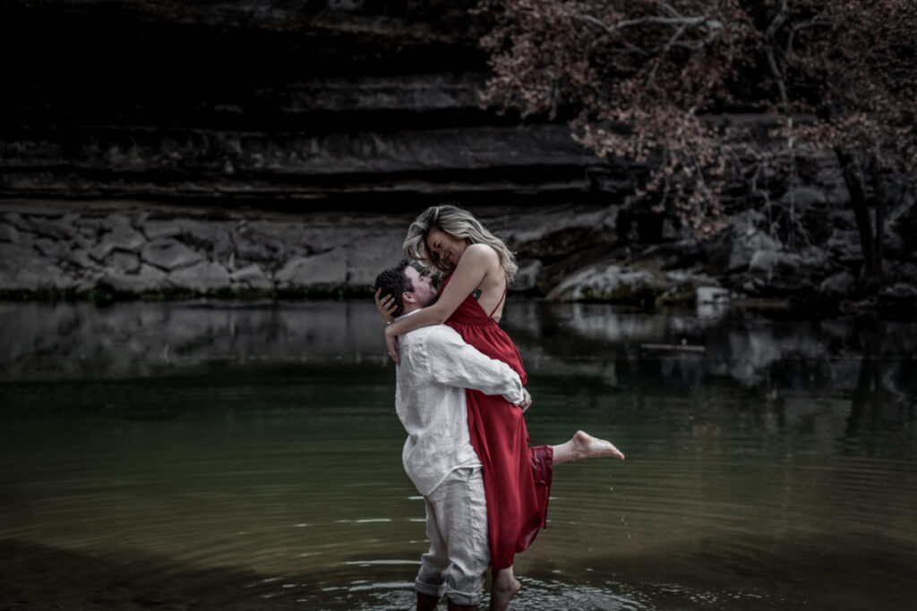 stunning engagement photo session of a young couple at Hamilton Pool Preserve and Hotel Vista