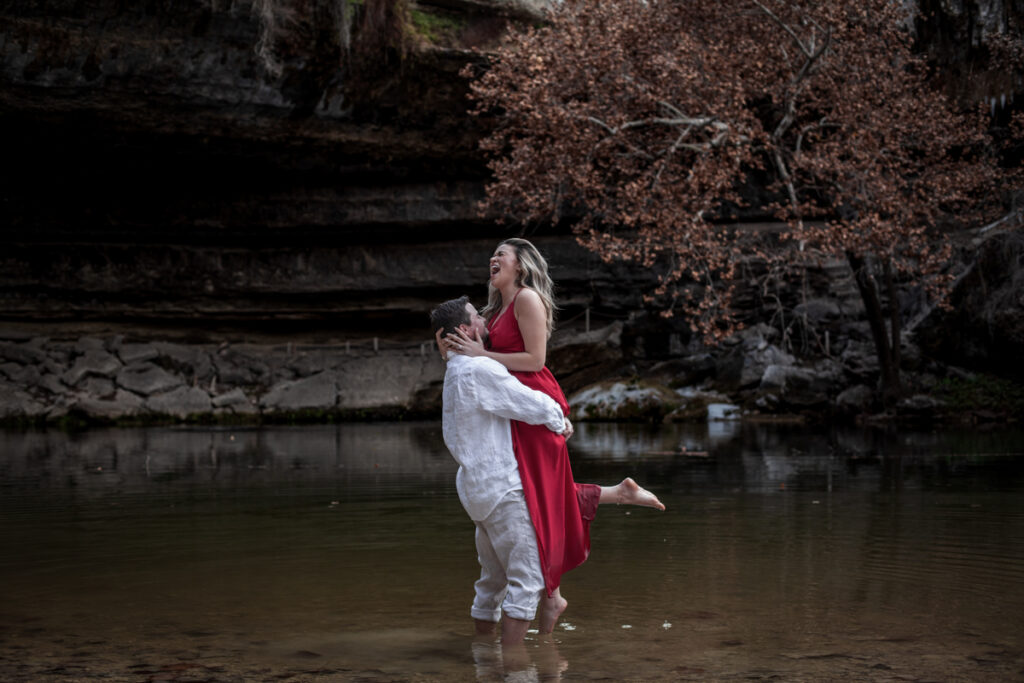 stunning engagement photo session of a young couple at Hamilton Pool Preserve and Hotel Vista