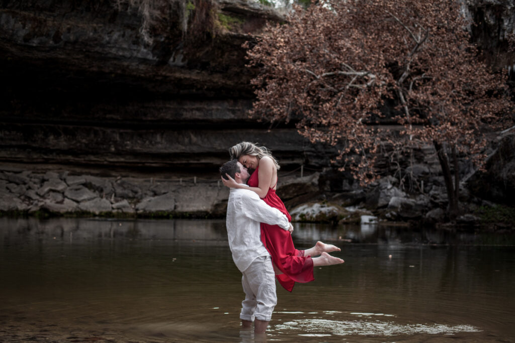 stunning engagement photo session of a young couple at Hamilton Pool Preserve and Hotel Vista