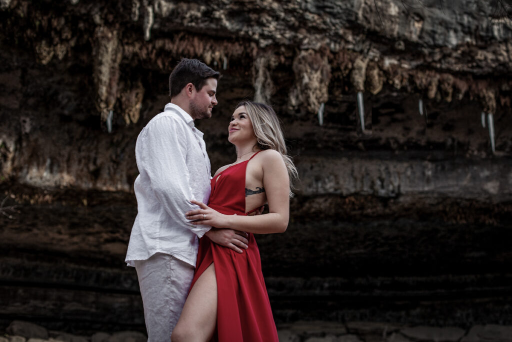 stunning engagement photo session of a young couple at Hamilton Pool Preserve and Hotel Vista