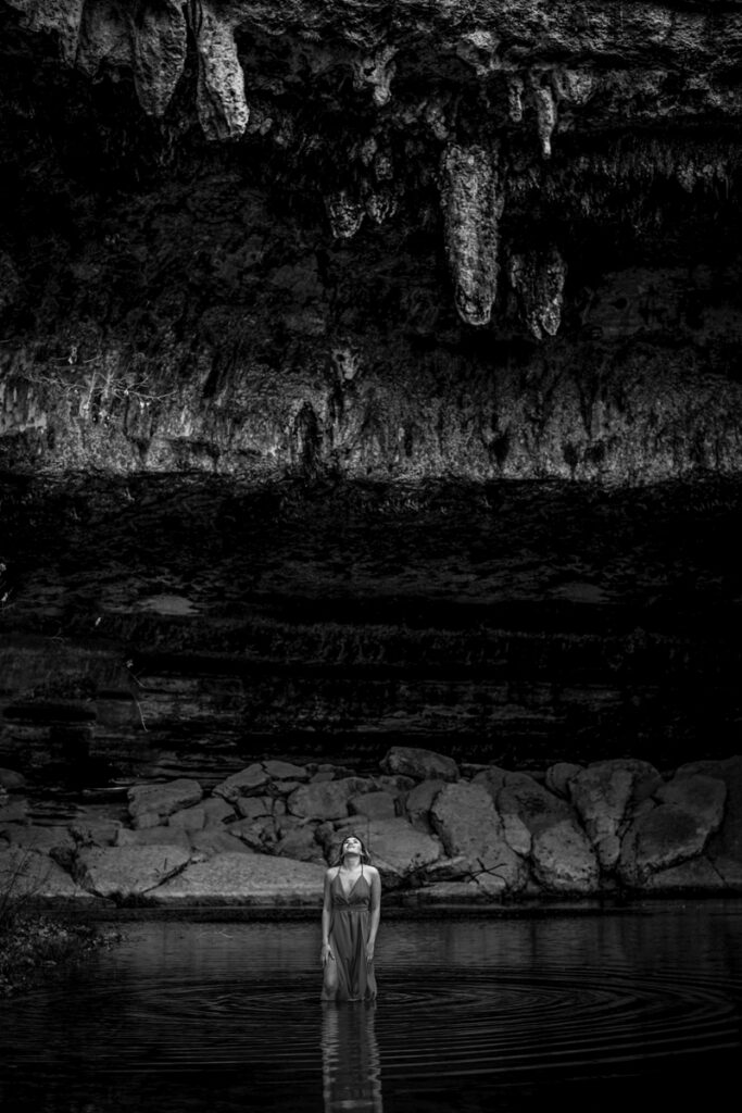 stunning engagement photo session of a young couple at Hamilton Pool Preserve and Hotel Vista