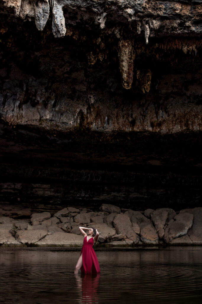 stunning engagement photo session of a young couple at Hamilton Pool Preserve and Hotel Vista