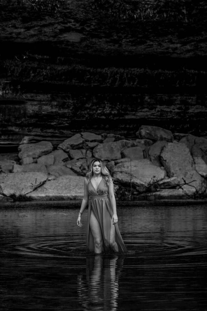 stunning engagement photo session of a young couple at Hamilton Pool Preserve and Hotel Vista