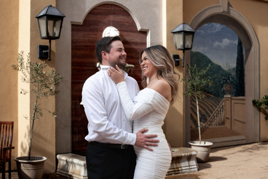 stunning engagement photo session of a young couple at Hamilton Pool Preserve and Hotel Vista