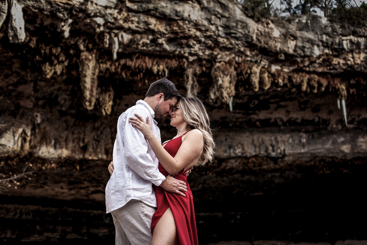 engagement photo session of a young couple at Hamilton Pool Preserve and Hotel Vista