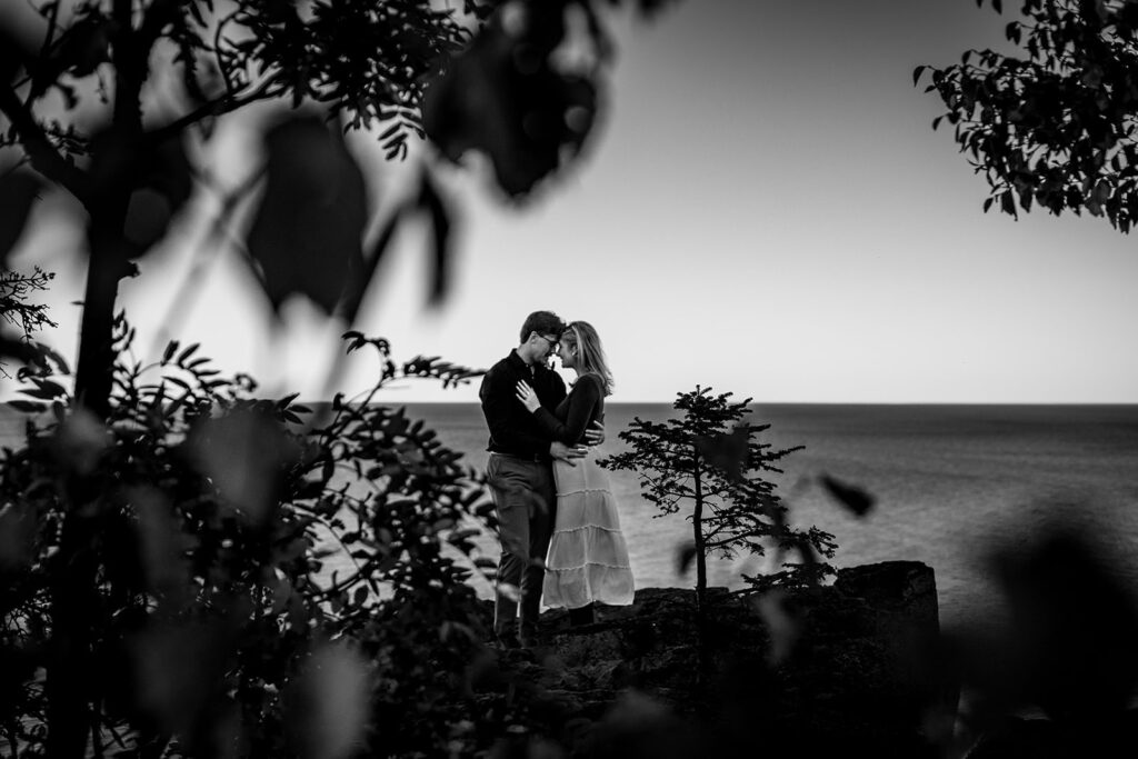 Couple embracing after a proposal at Palisade Head, North Shore MN