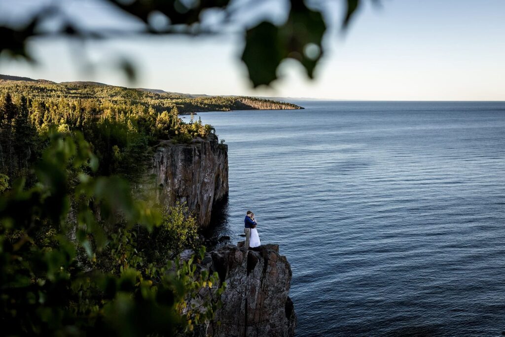 North Shore proposal photography with dramatic cliffs at Palisade Head