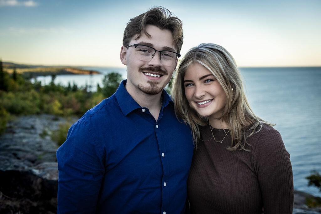 Couple smiling after saying yes at Palisade Head cliffs