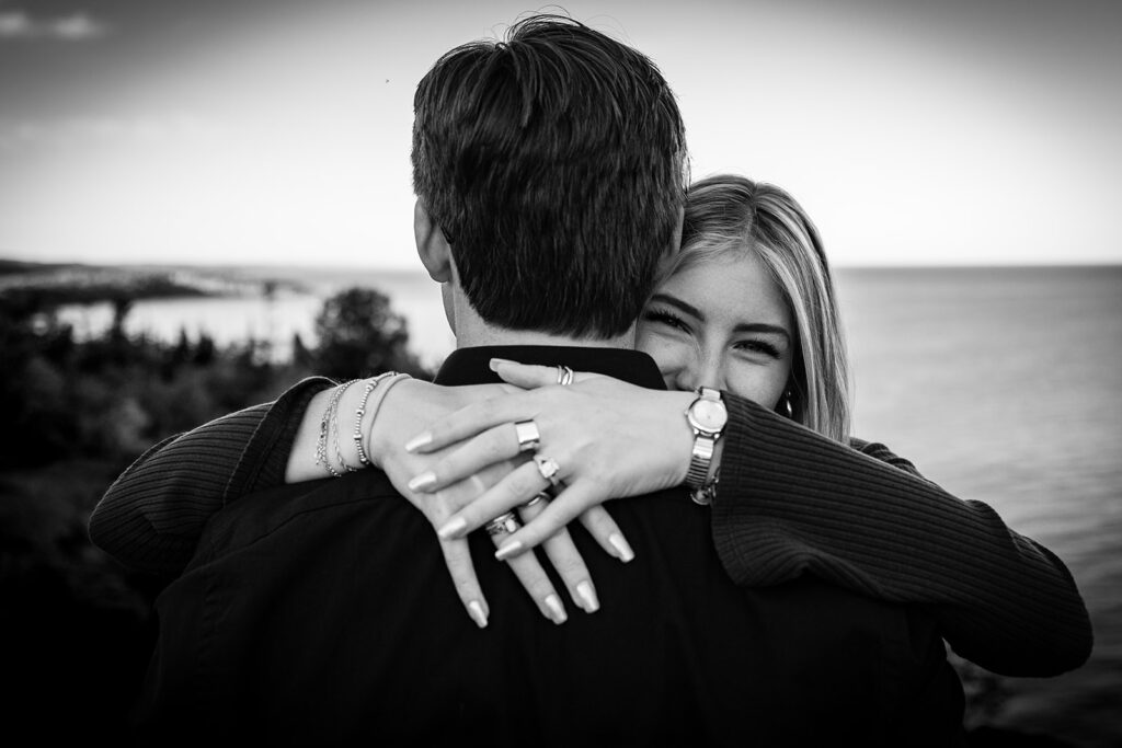 Joyful embrace after a surprise proposal on Minnesota’s North Shore