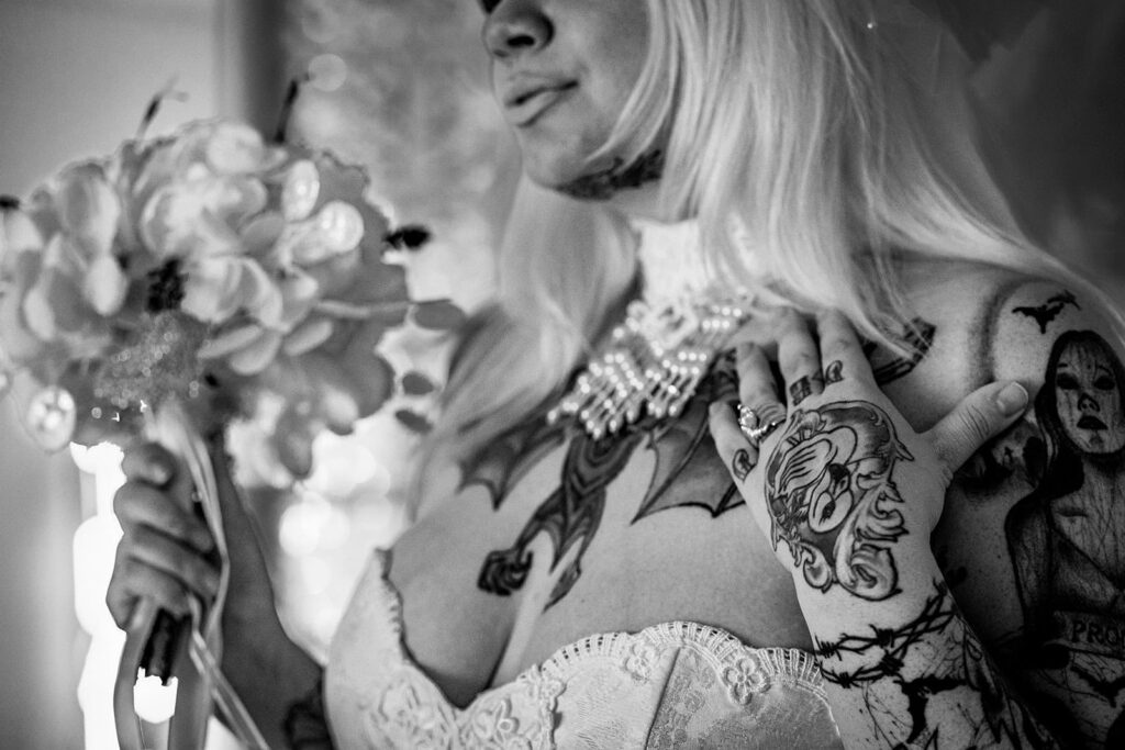 close up bridal details in vintage black and white at the garter toss chapel, mn
