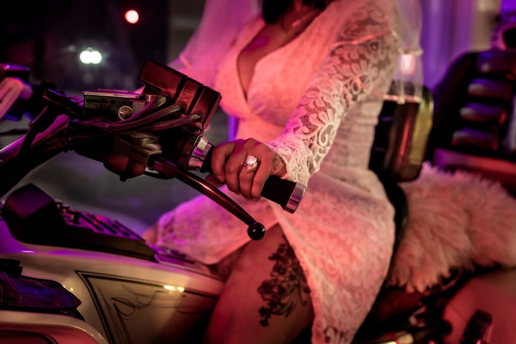 model wearing retro-inspired lace dress at the garter toss wedding chapel