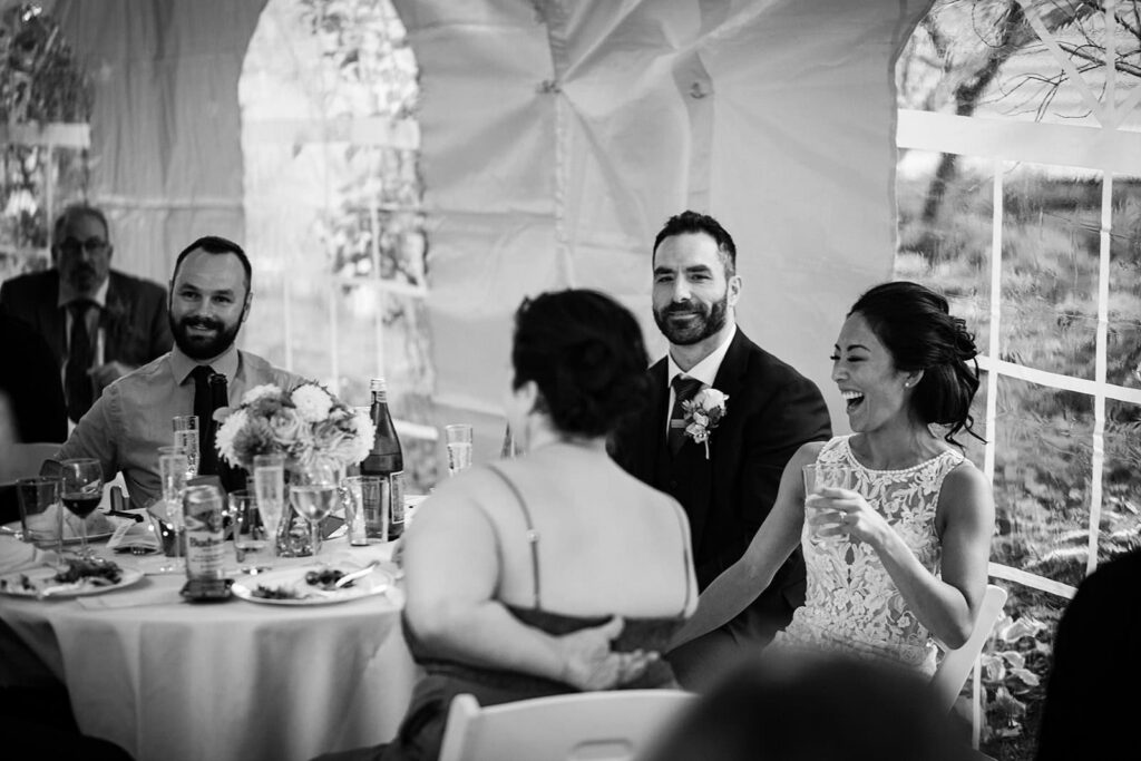 tent reception area during backyard wedding