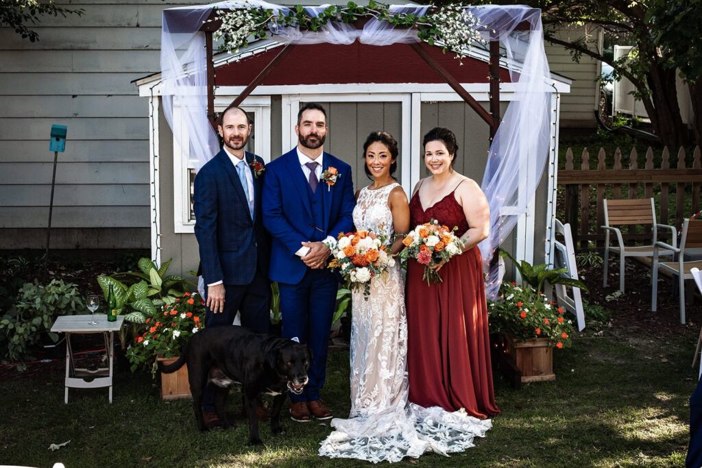 group photo in the backyard after wedding ceremony in minnesota