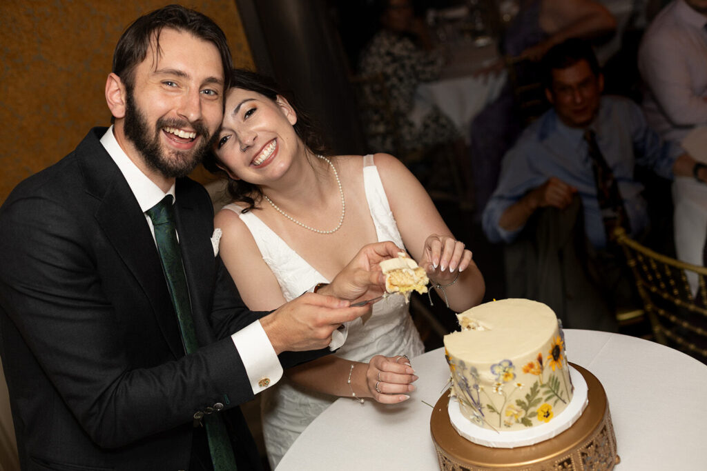 cake cutting moment at minneapolis wedding venue