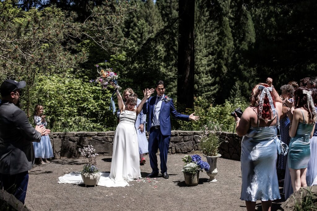 bride and groom celebrate during portland oregon wedding ceremony