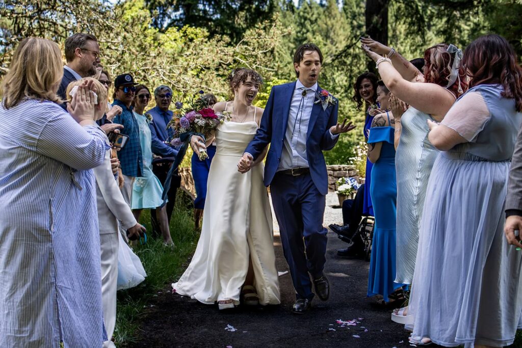couple walk down aisle after wedding ceremony in portland
