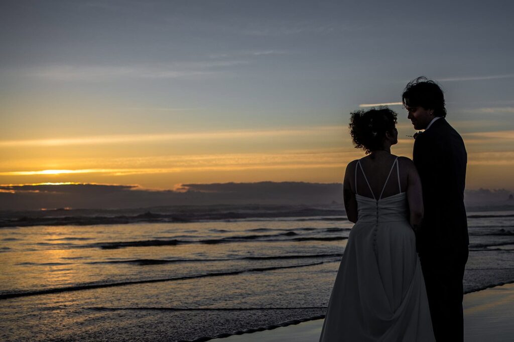 wedding photos at cannon beach as the sun sets