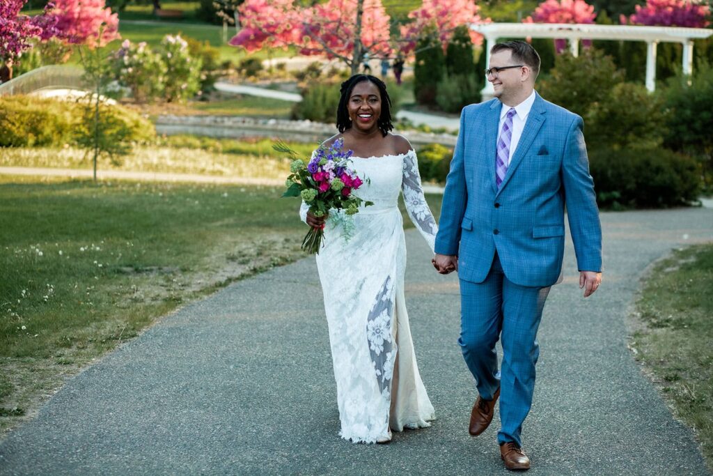 Adventure-style Minnesota elopement photography of a couple walking hand-in-hand.
