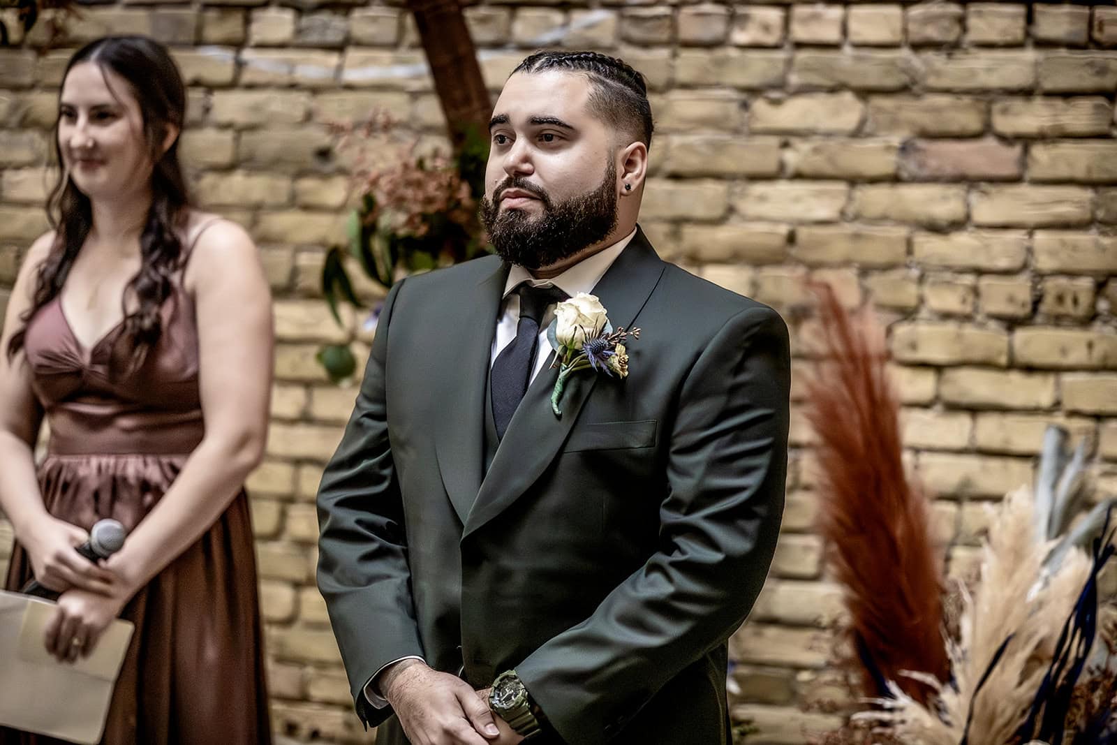 Groom smiling as he sees his bride during their Minneapolis ceremony.