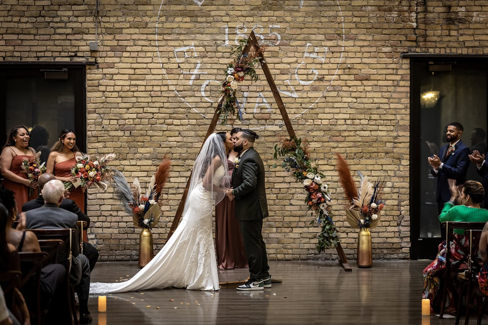 First kiss as husband and wife at the Lumber Exchange Event Center ceremony.