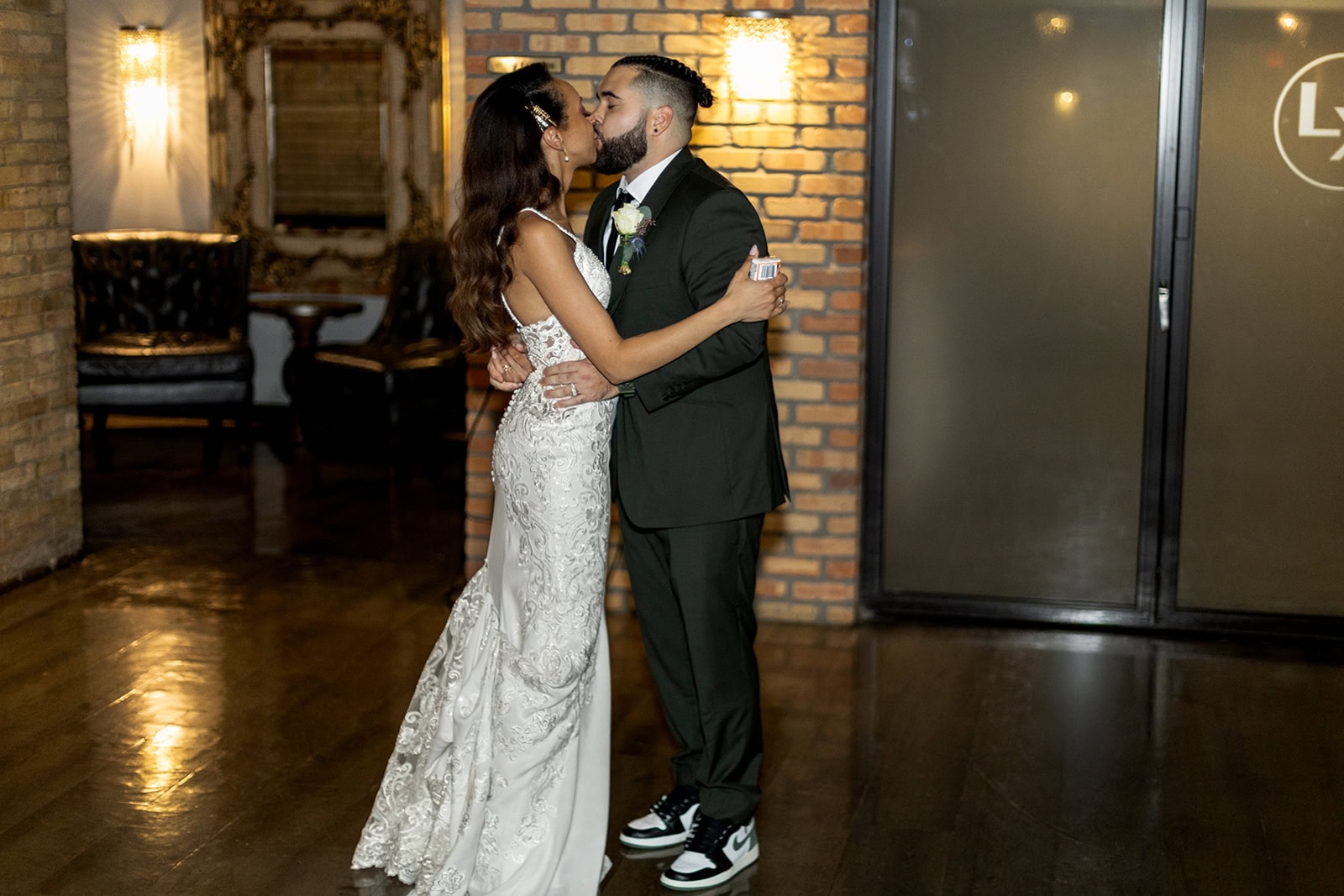 Bride and groom sharing their first dance at lumber exchange wedding venue.