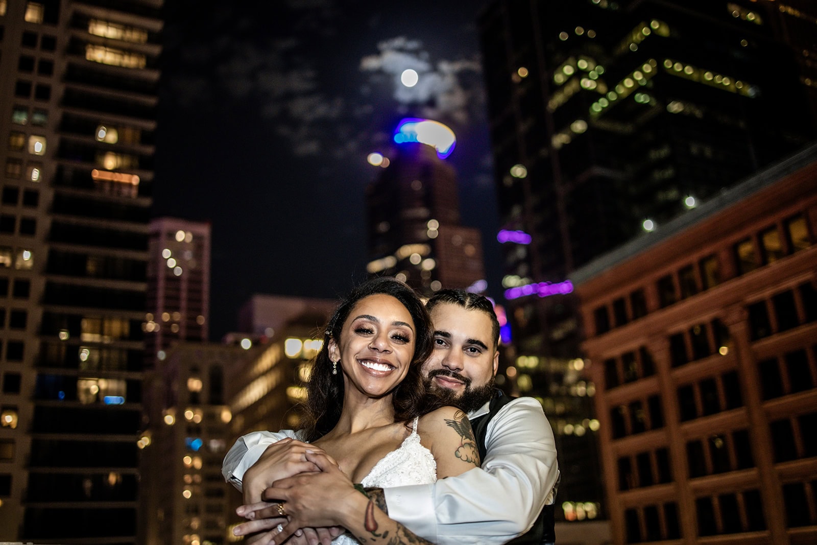 Romantic evening portrait on rooftop in downtown Minneapolis, Minnesota.