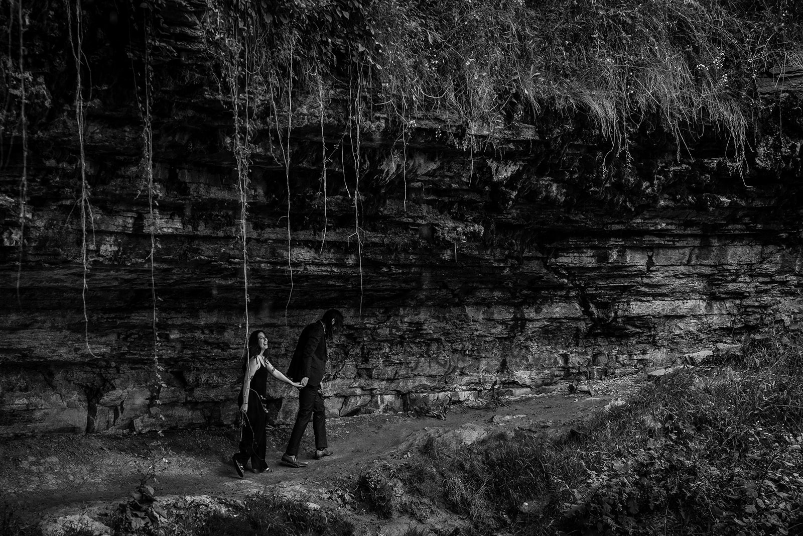 Jessica smiling during late summer engagement portraits at Minnehaha Park