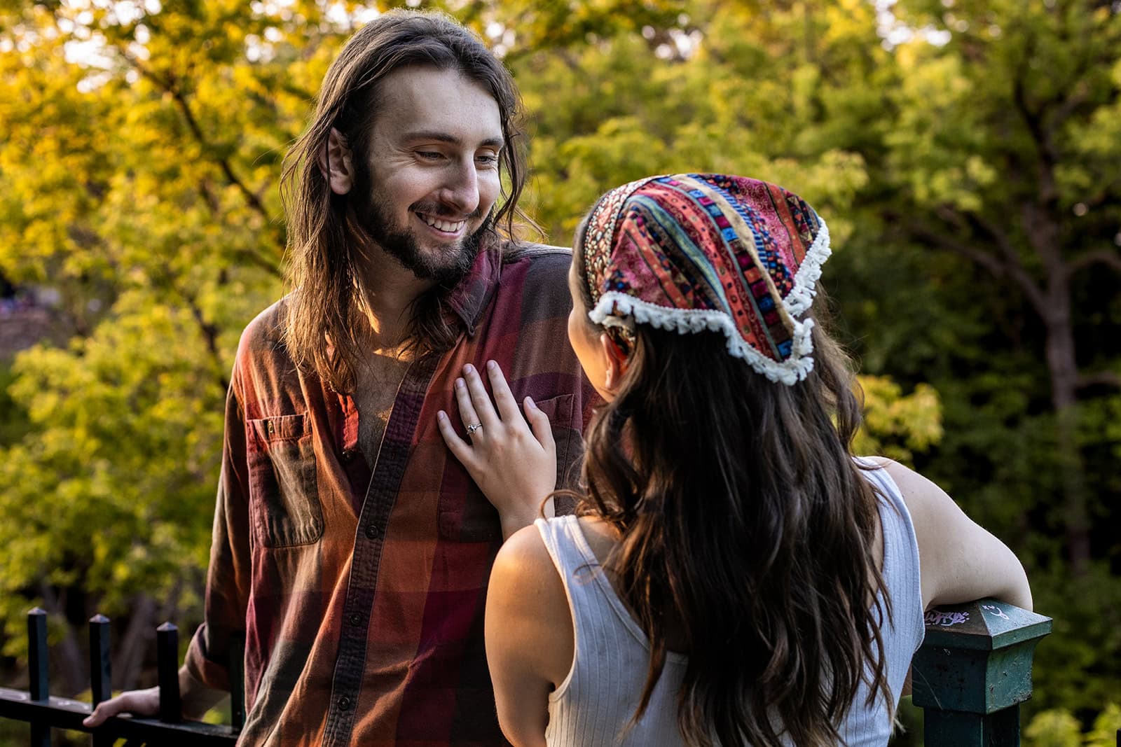 Candid engagement photo of couple laughing at Minnehaha Falls Minneapolis