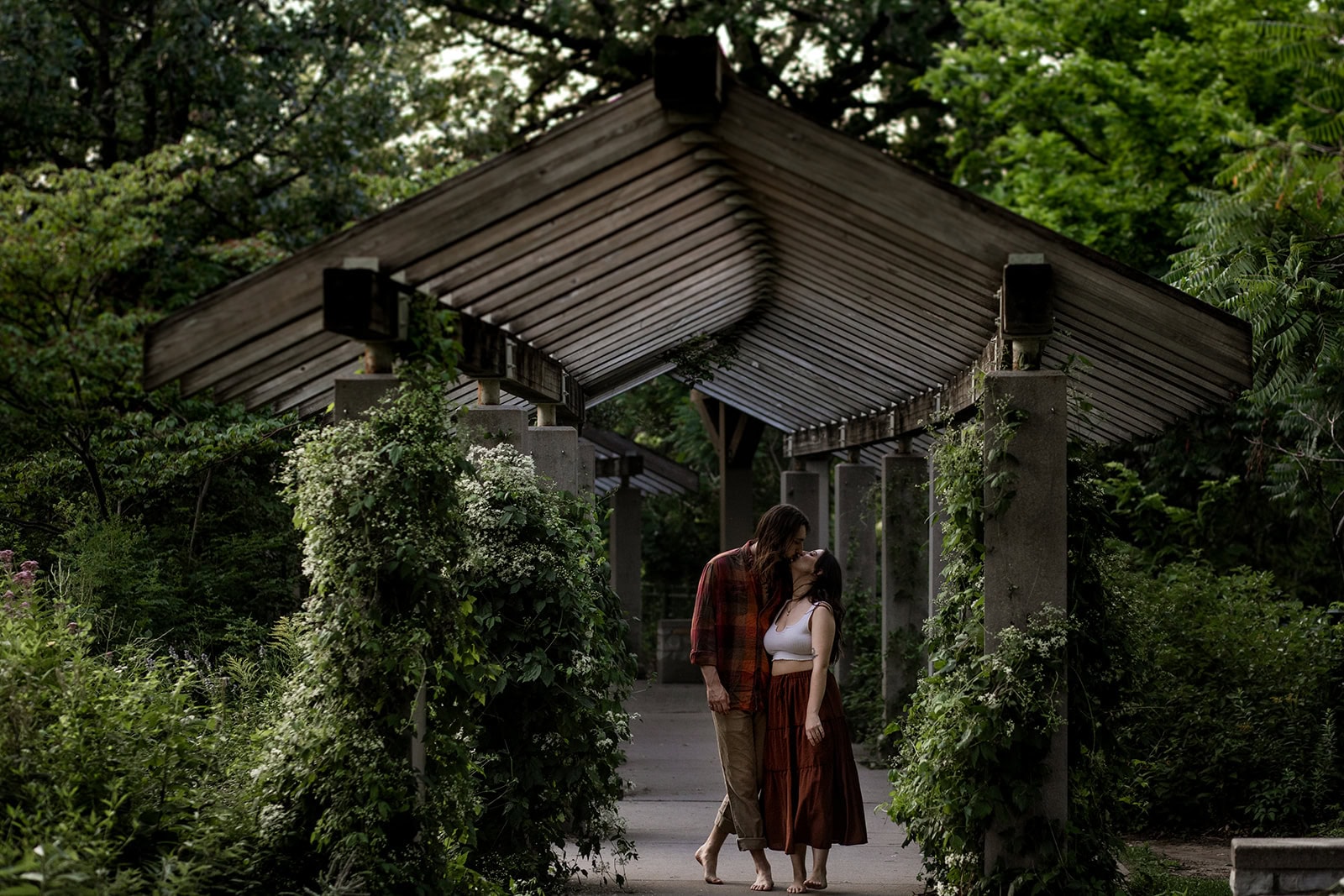 Jessica and Isaac stealing a kiss near Minnehaha Falls in August