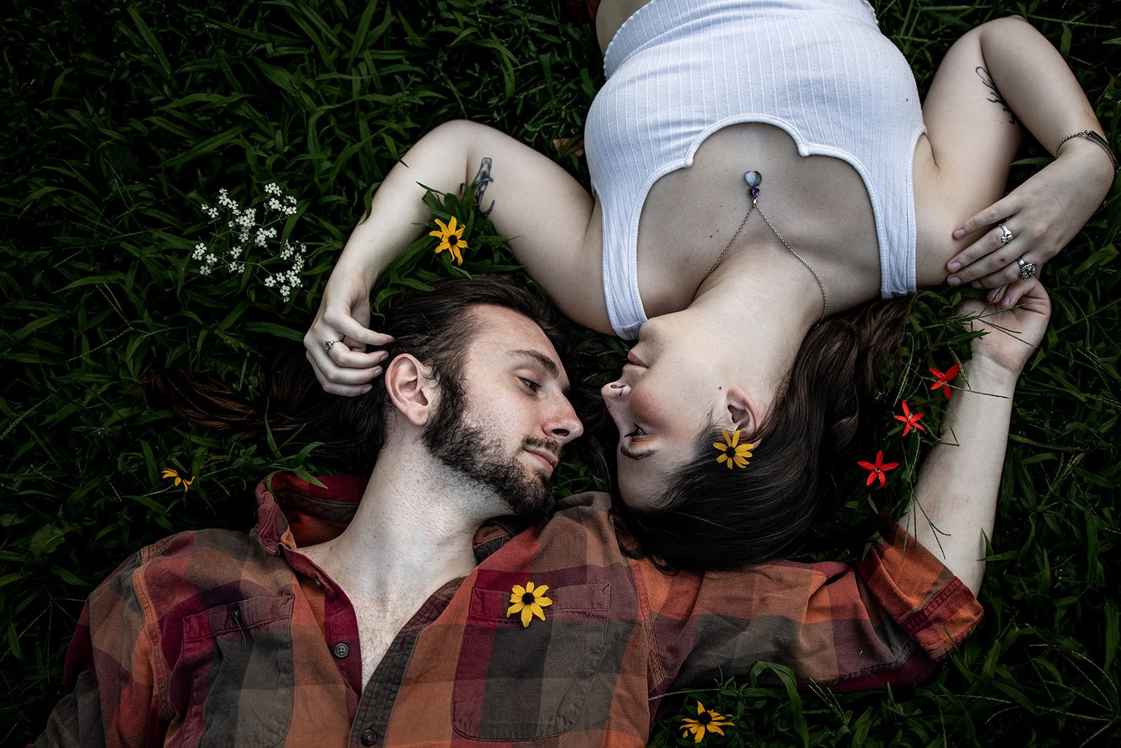Late summer wildflowers framing an engagement portrait at Minnehaha Falls