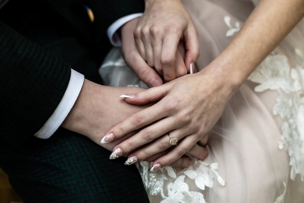 Close-up of couple's hands during wedding day portraits in St Paul, MN