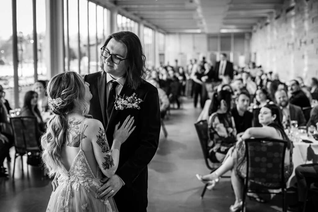 Guests watching the couple's first dance at their Como Zoo Conservatory reception