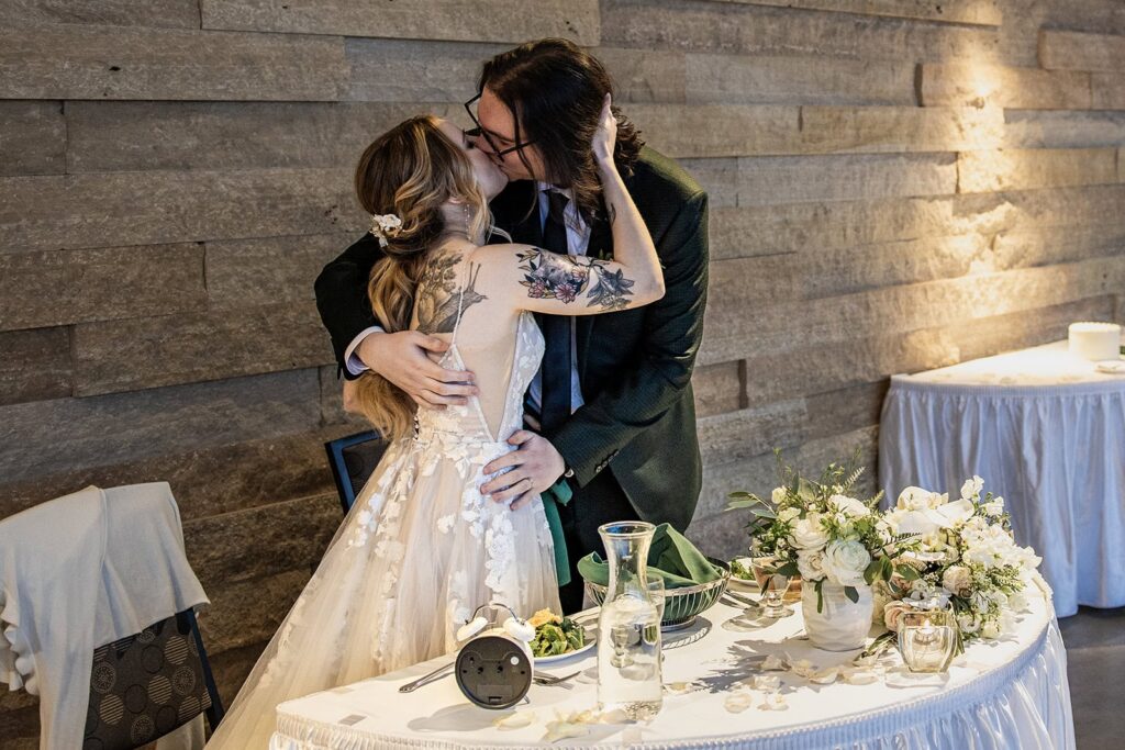 bride and groom kissing during st paul wedding reception