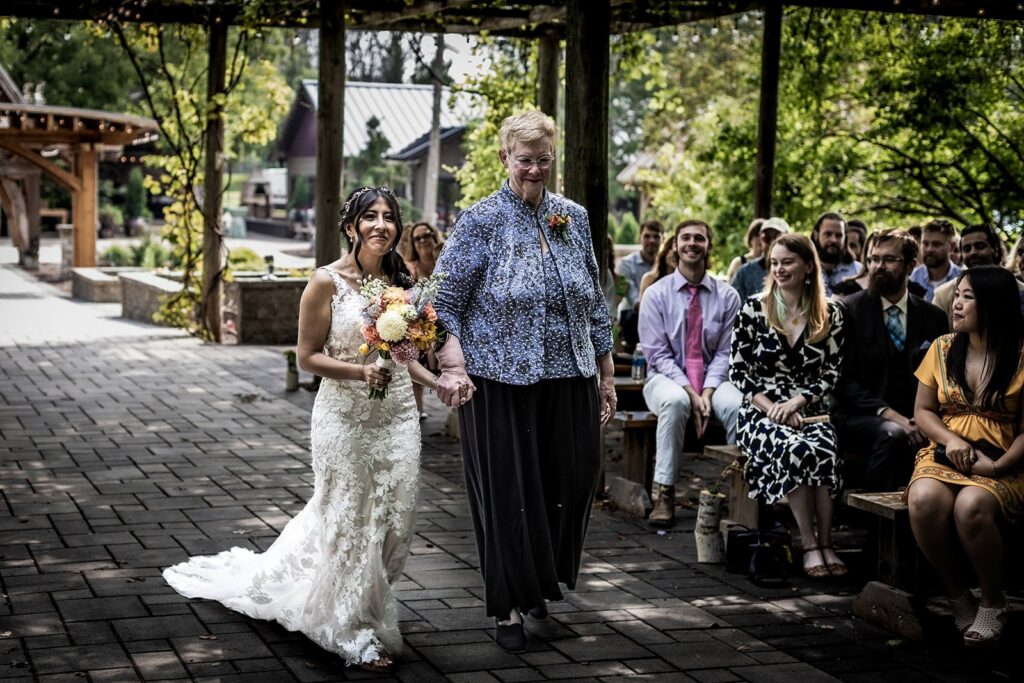Bride walking down the aisle at Gardens of Castle Rock wedding
