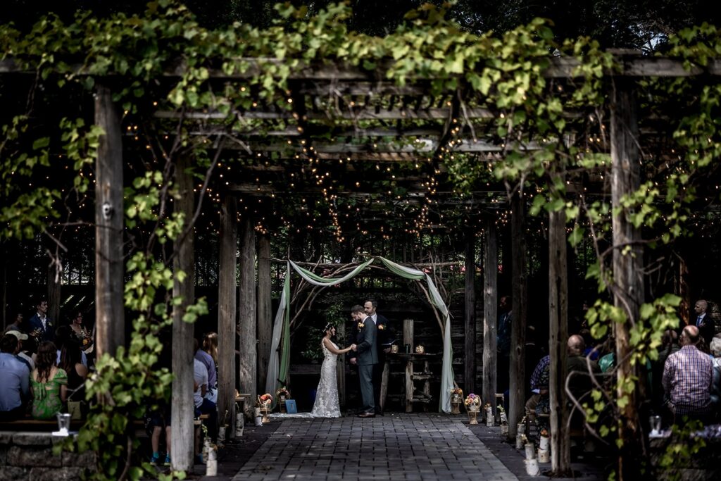 Wide shot of outdoor wedding ceremony at minnesota wedding venue