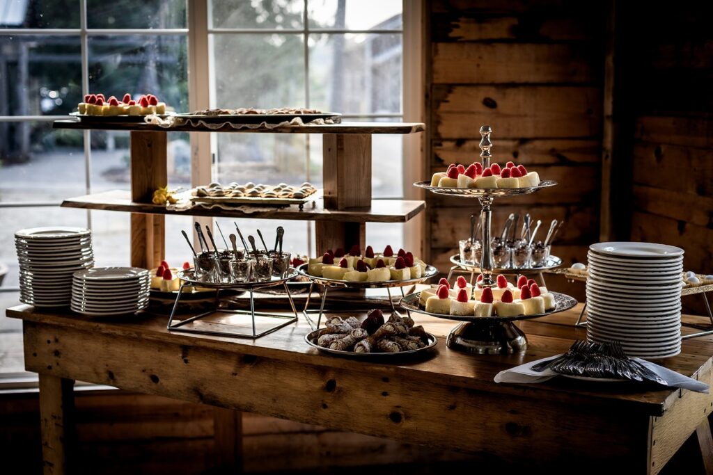 cakes and sweet treats displayed at gardens of castle rock wedding