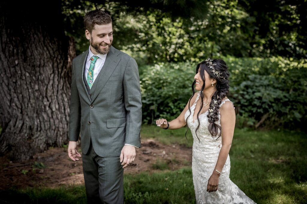 Bride and groom sharing a first look at Gardens of Castle Rock wedding