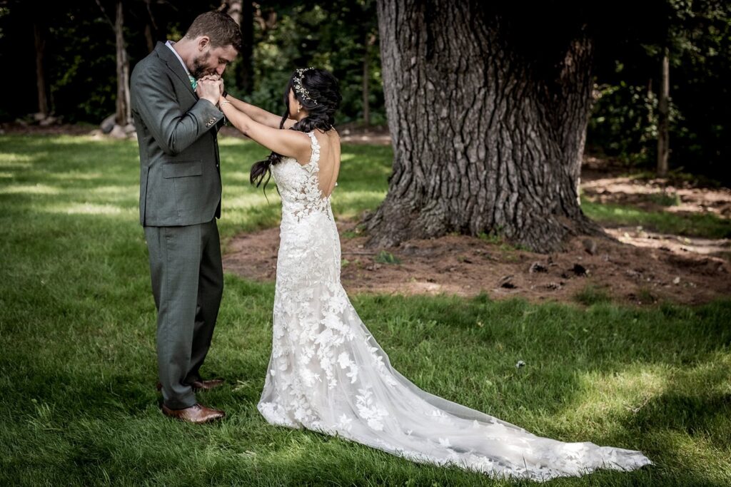 Groom seeing his bride for the first time on their wedding day